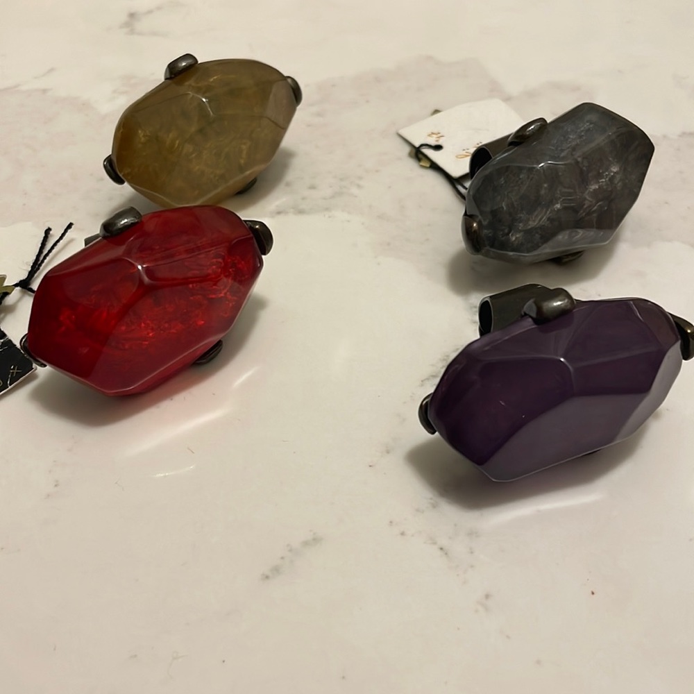 NWT set of four fun and unique lucite adjustable rings